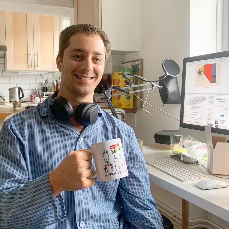 Adrian with custom Mendeley Search mug featuring his cartoon cat drawing